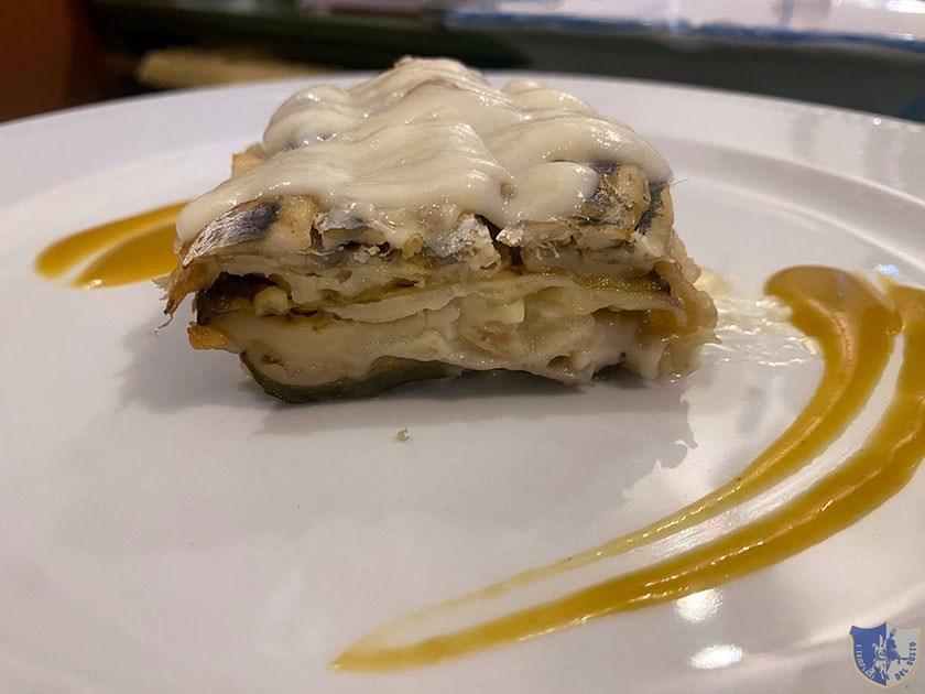 Parmigiana di alici e melanzane con salsa di datterino giallo e fonduta di provola affumicata